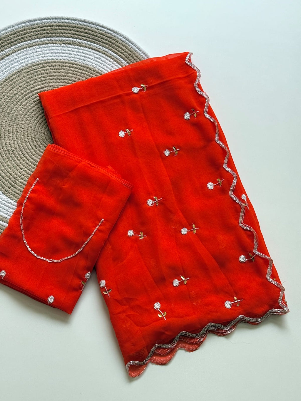 ORANGE GEORGETTE SAREE WITH CUTDANA AND BUTTI WORK